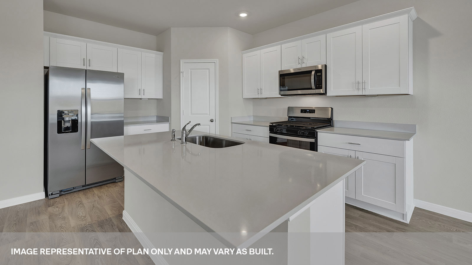 Kitchen with kitchen island and stainless steel appliances.