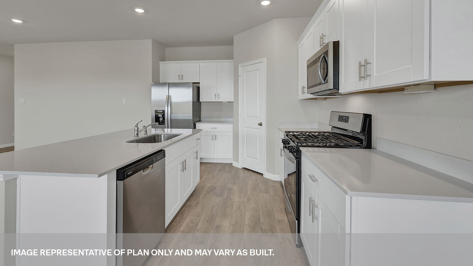 Kitchen with kitchen island and quartz countertops.