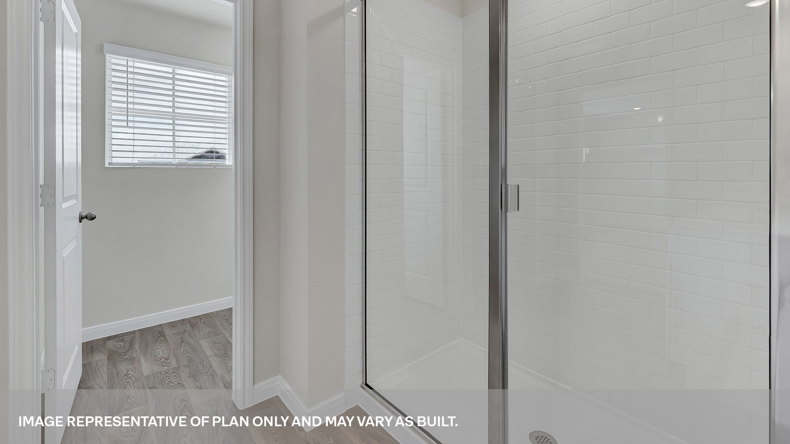 Main bathroom with walk-in shower and shoower glass door.