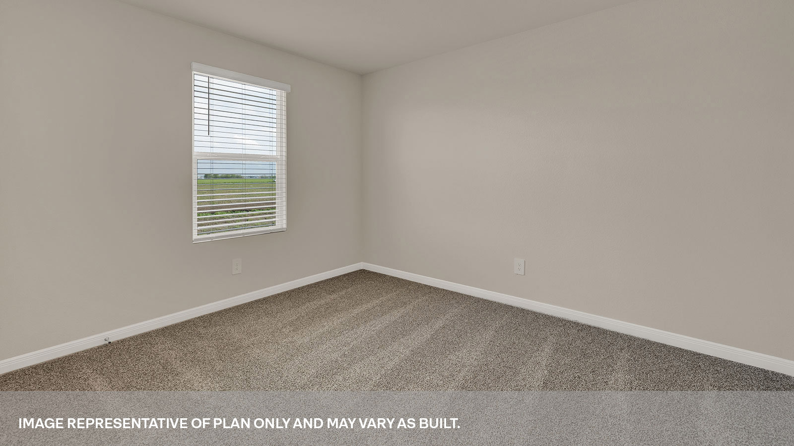 Bedroom with carpeting and one window.