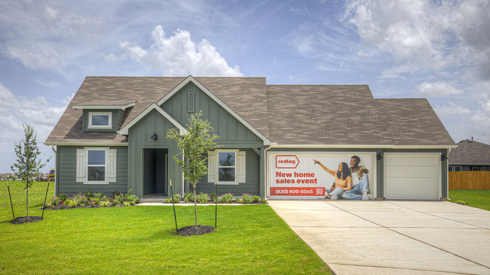Single-story farmhouse with 3 car garage.