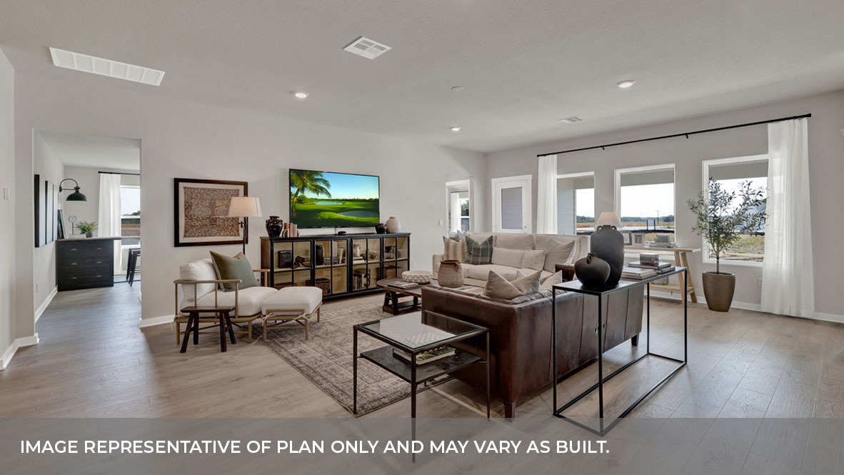 Family room with windows and vinyl flooring.