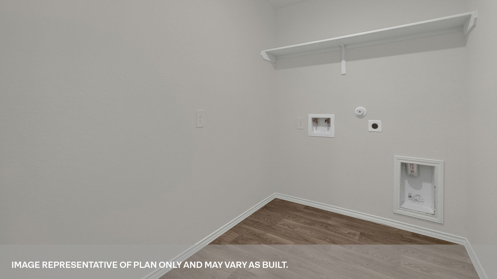 Laundry room with a wood shelf and washer/dryer connections.