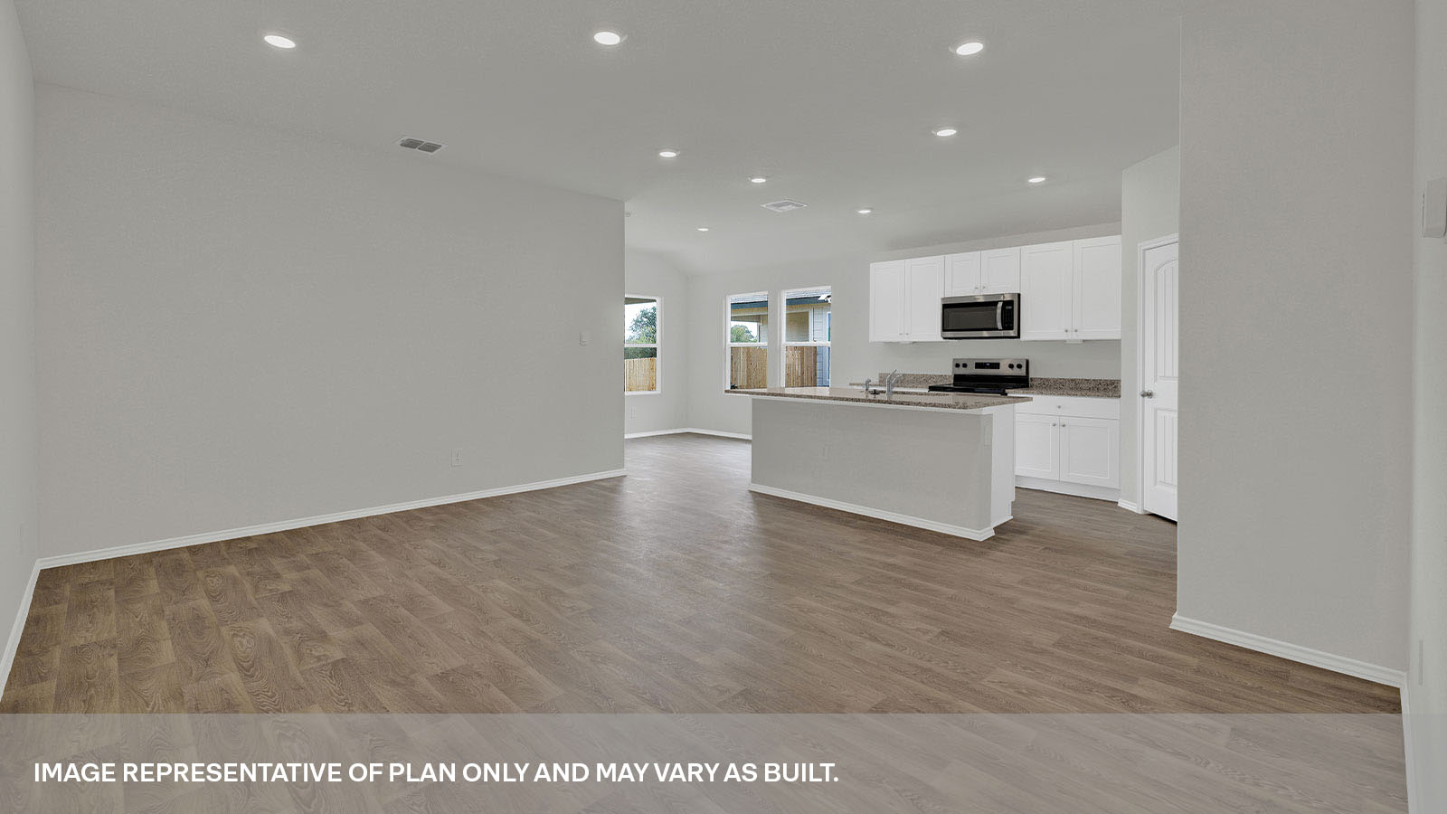 Living room open to the kitchen and dining area.