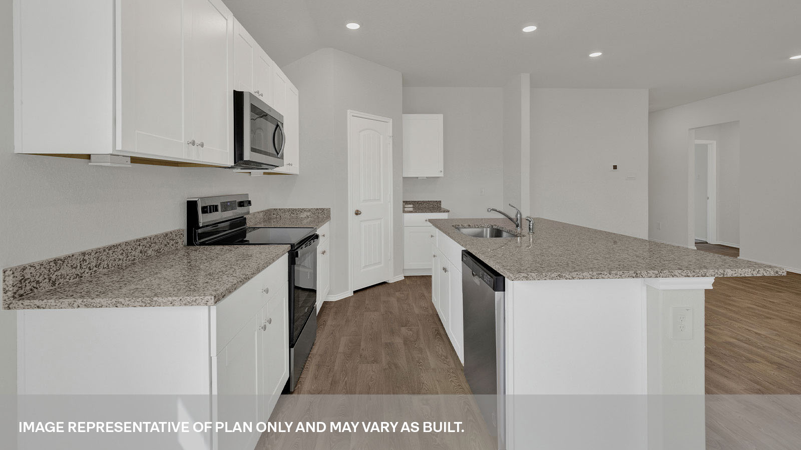 Kitchen with a kitchen island and large sink.