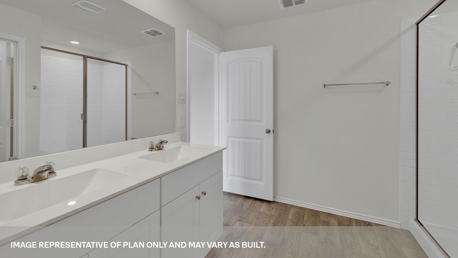 Main bathroom with a double sink and walk-in shower.