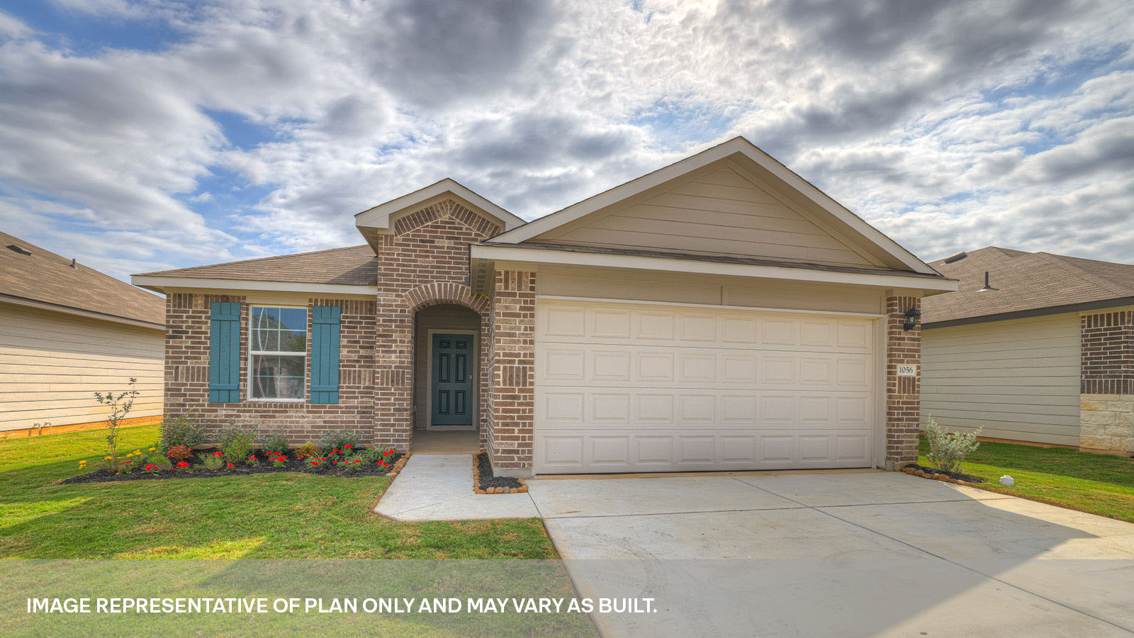 Single story home with brick, one window in the front, and a 2 car garage.