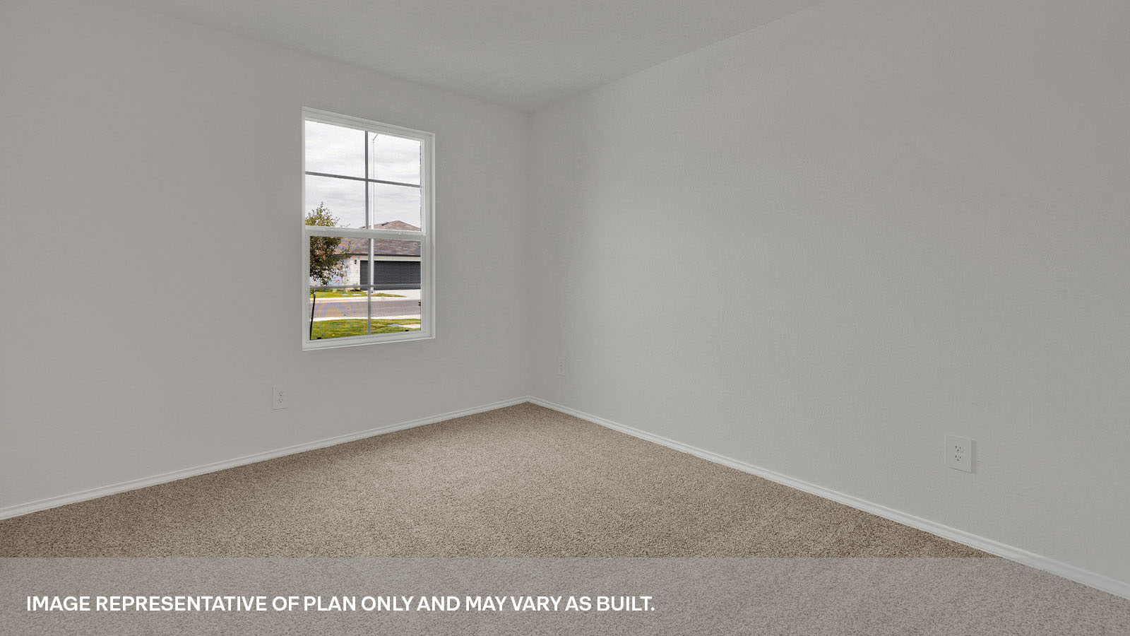 Front bedroom with carpeting and a window showing the front yard.