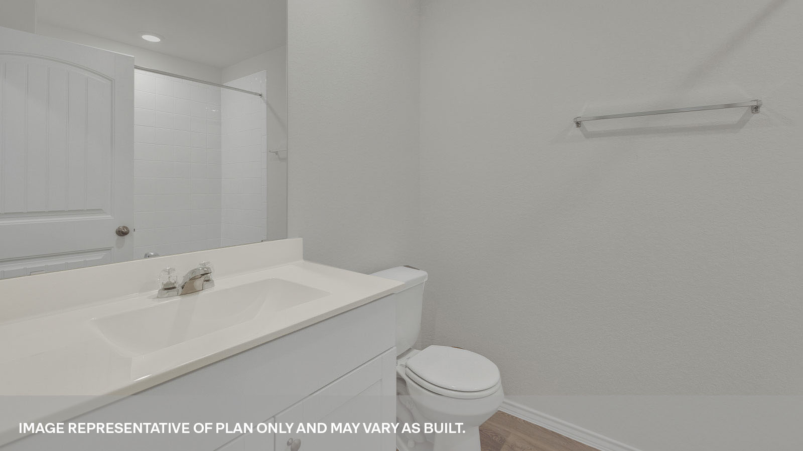 Bathroom with a tile surround shower/tub combo and brown cabinets.