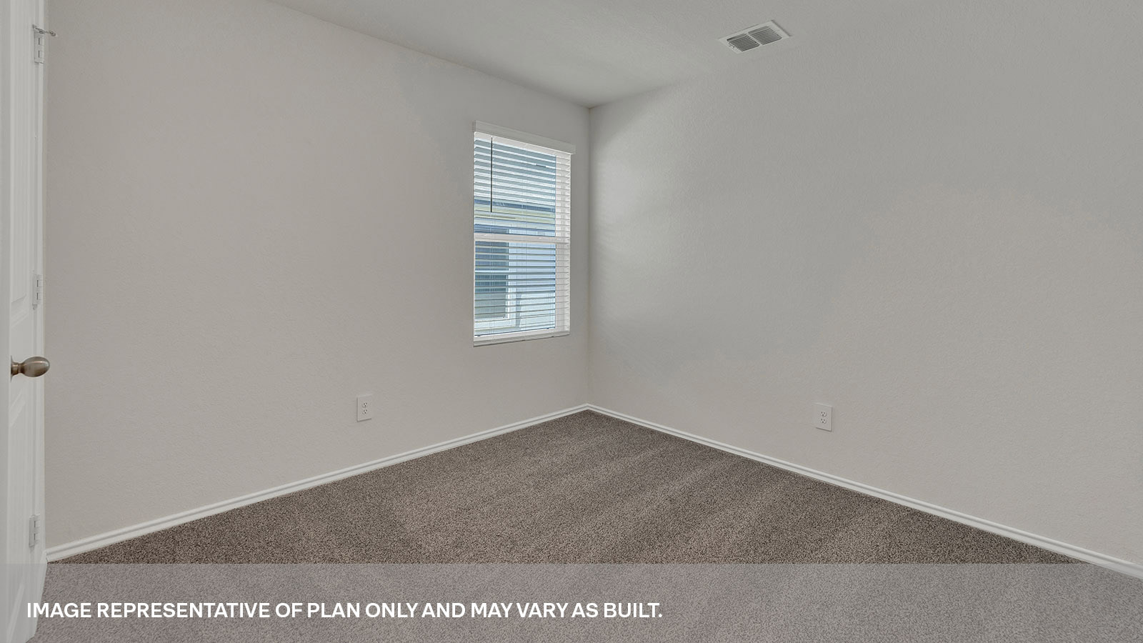 Bedroom with carpeting and one window.