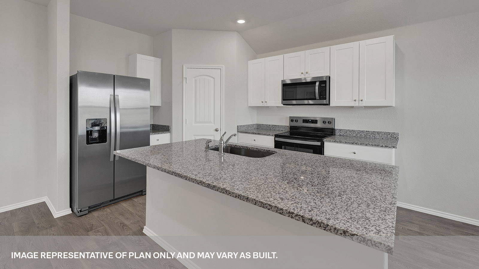 Kitchen with a dishwasher, and pantry located in the corner.