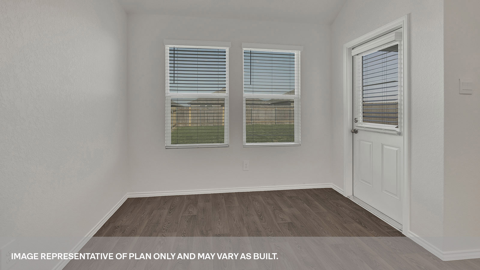 Dining area with 2 windows and a backdoor with a half-lite window.