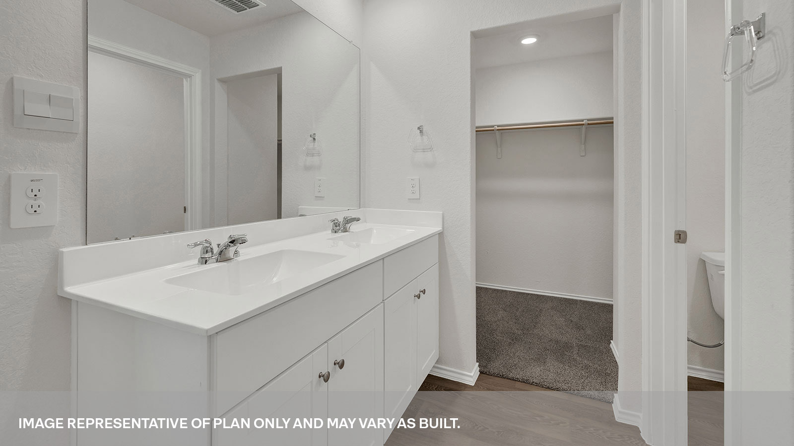 Main bathroom with a single sink and walk-in closet.