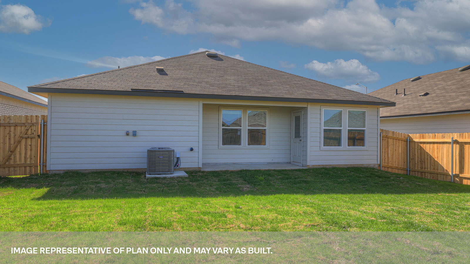 Covered back patio with windows and door with half lite window.
