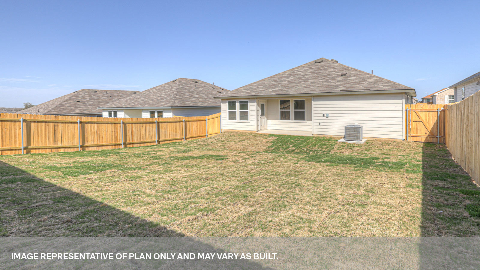 Covered back patio with windows and door with half lite window.