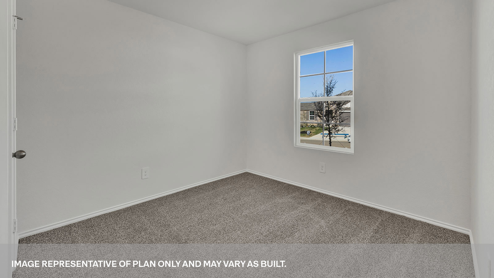 Front bedroom with carpeting and a window showing the front yard.
