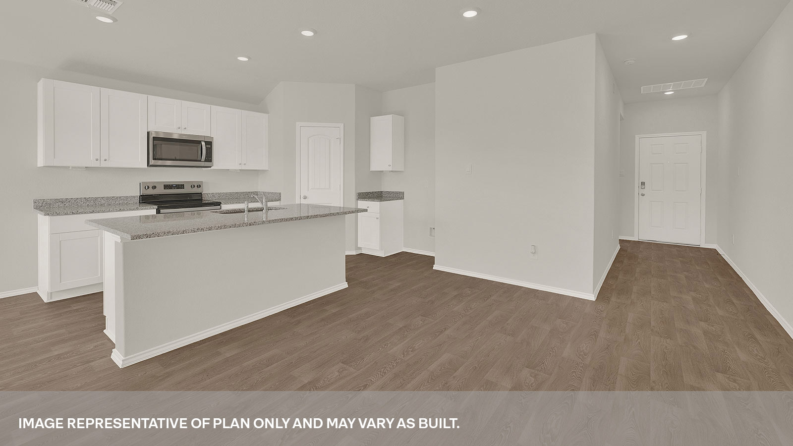 Kitchen with kitchen island and entry hallway.