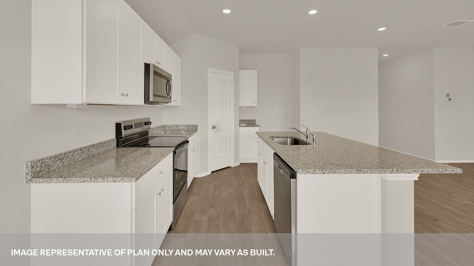 Kitchen with kitchen island and white cabinets.