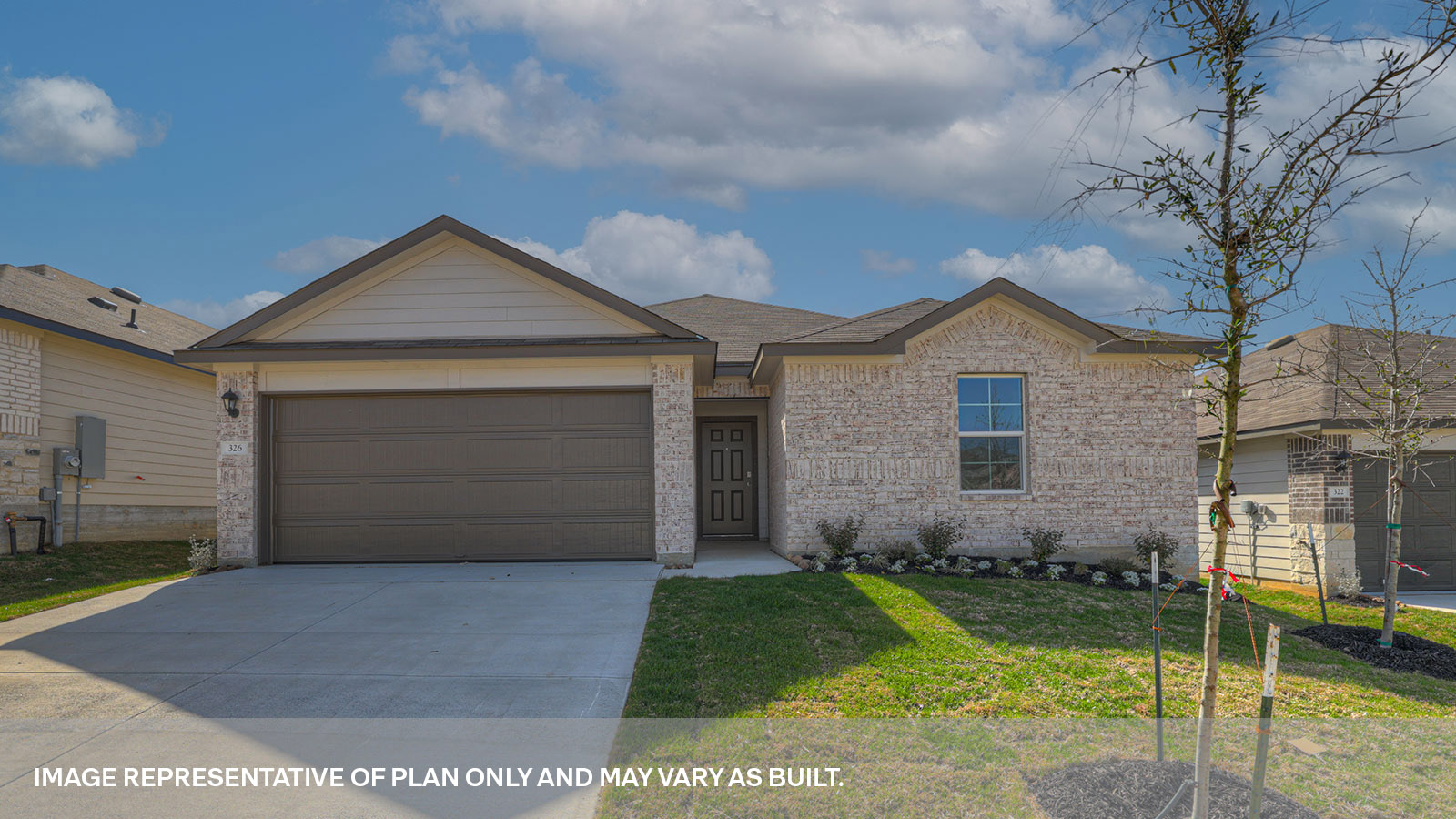 Single story home with brick, one window in the front, and a 2 car garage.