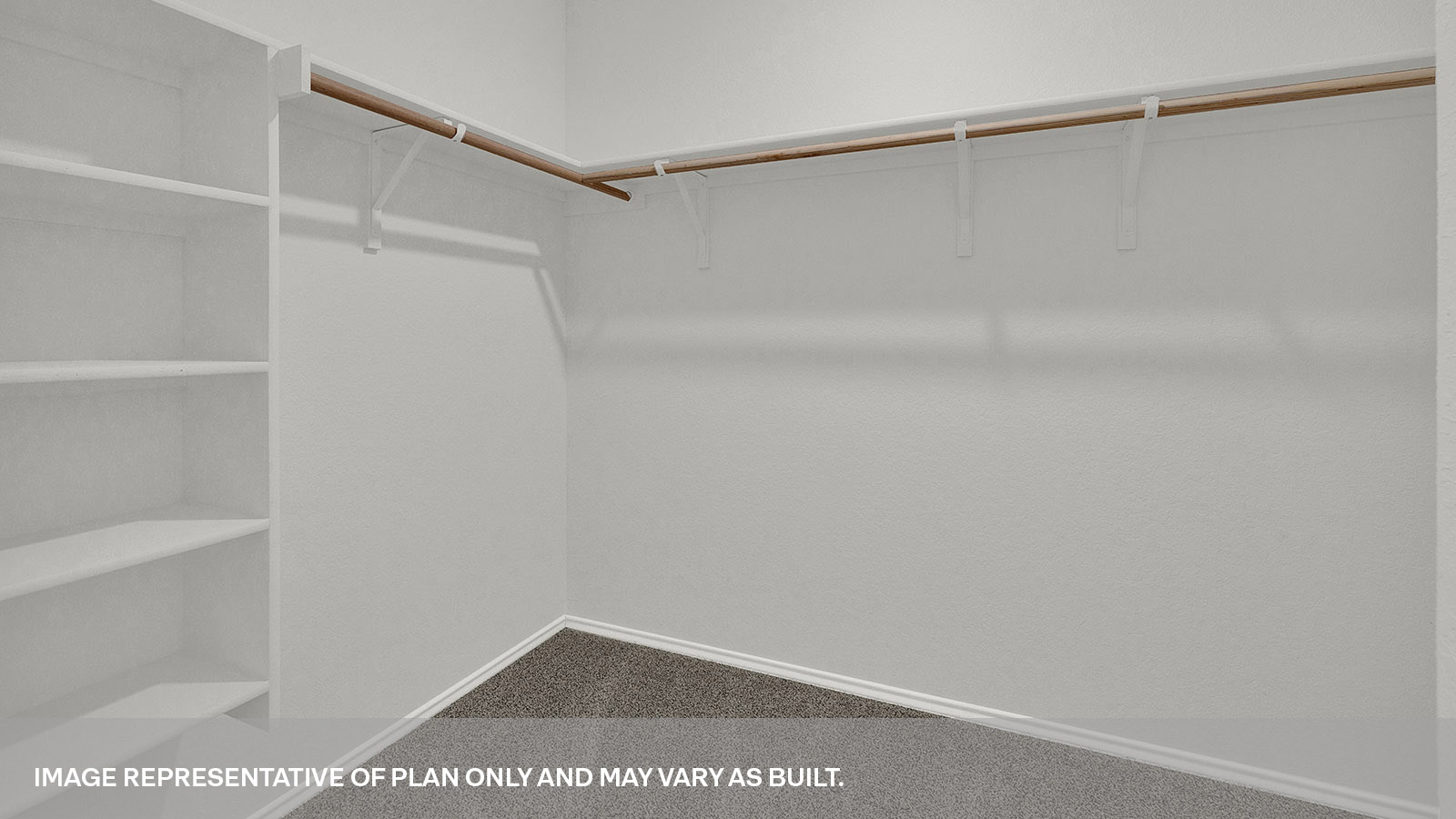 Walk-in closet with wooden shelves.