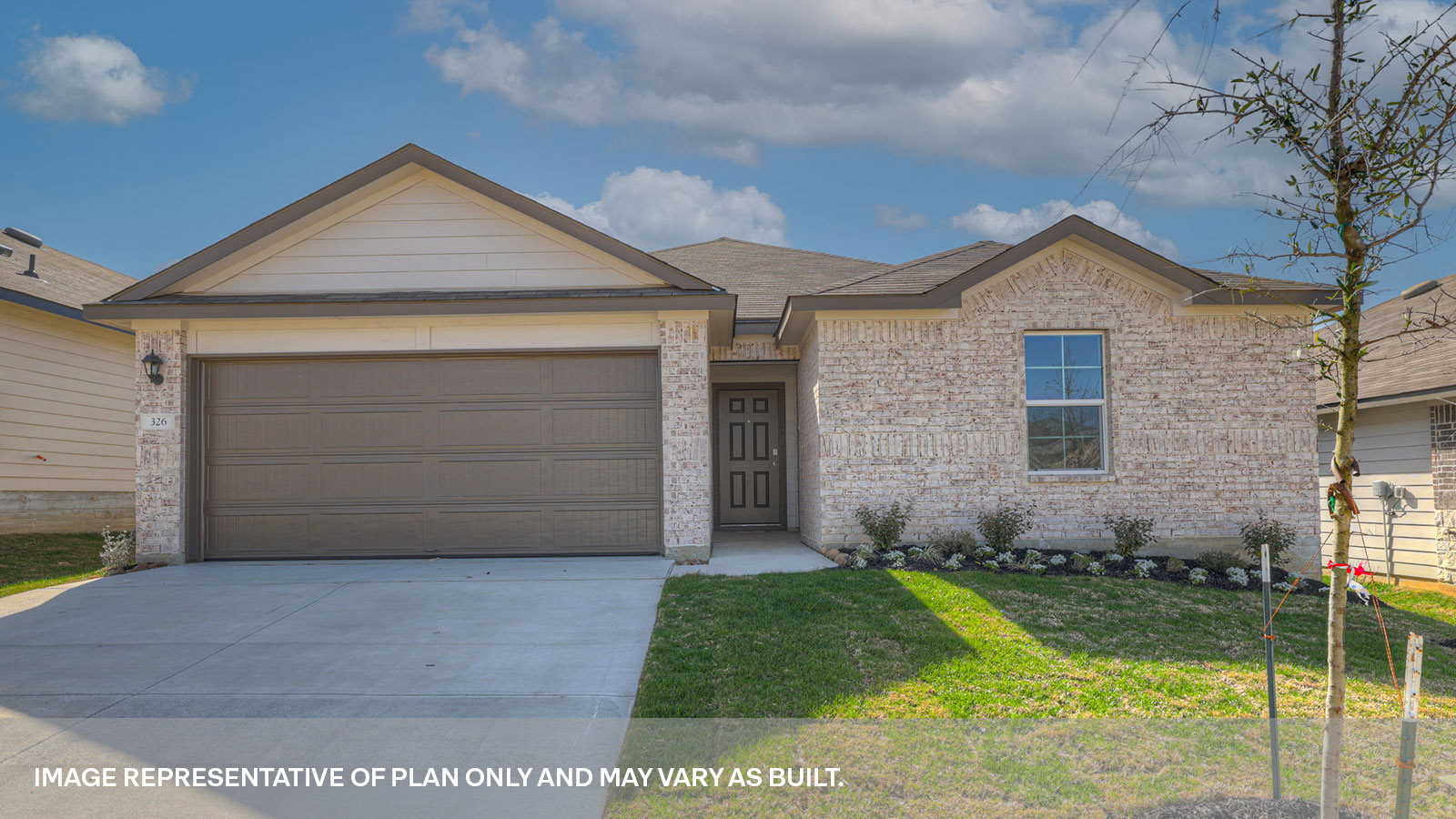 Single story home with stone and brick combo, one window in the front, and a 2 car garage.