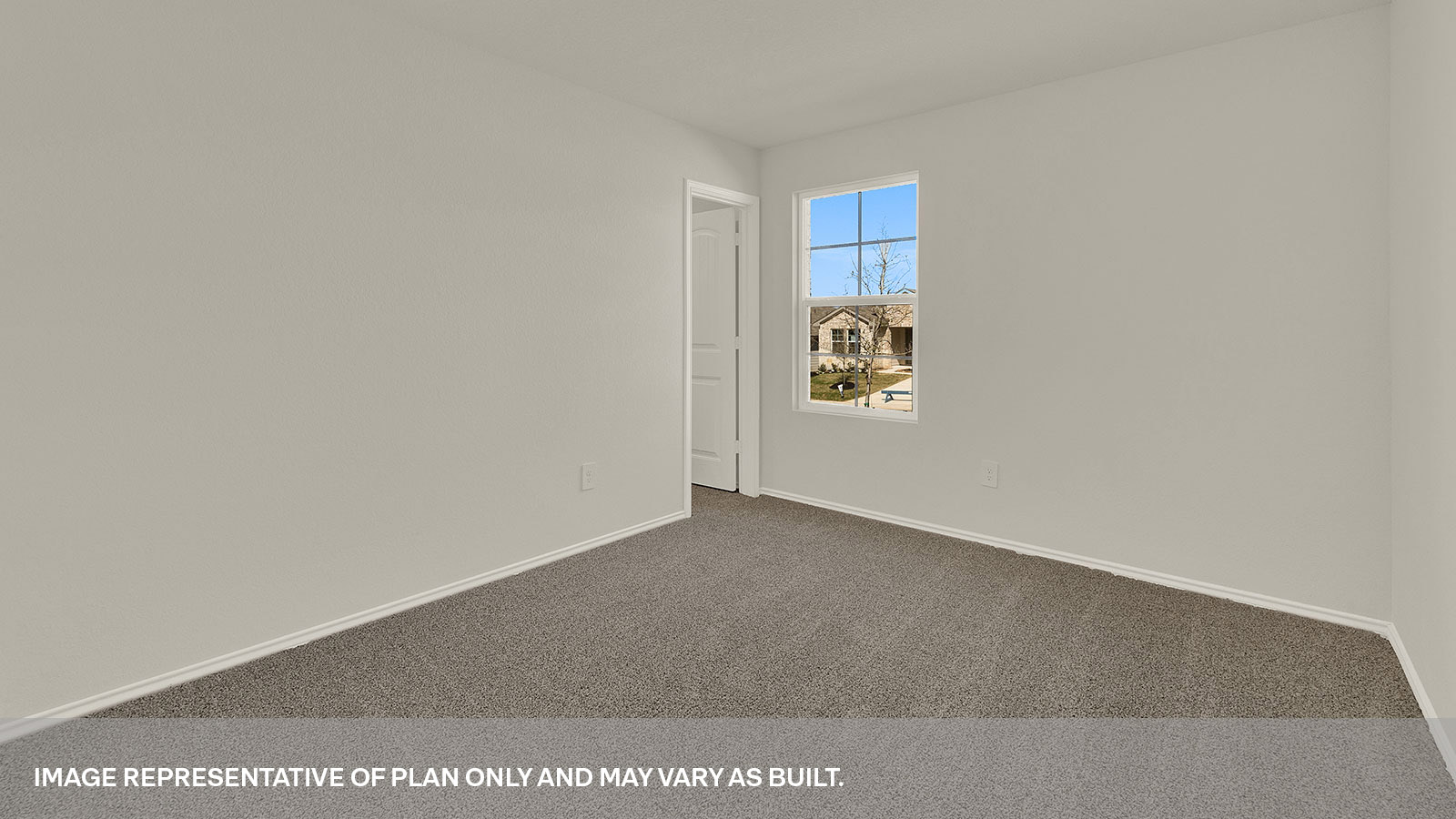 Front bedroom with carpeting and a window showing the front yard.