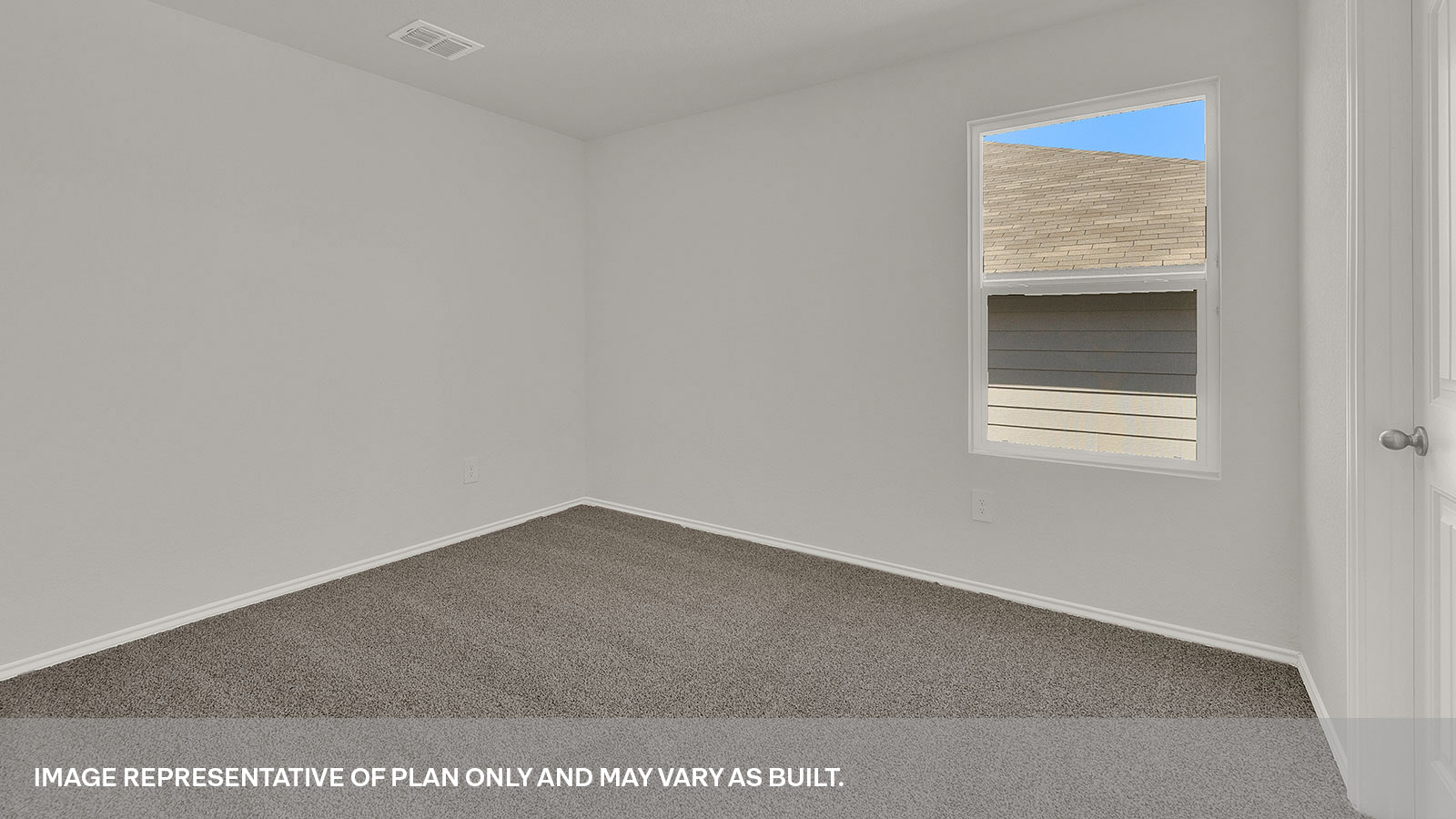 Second bedroom with carpeting and a window showing the front yard.