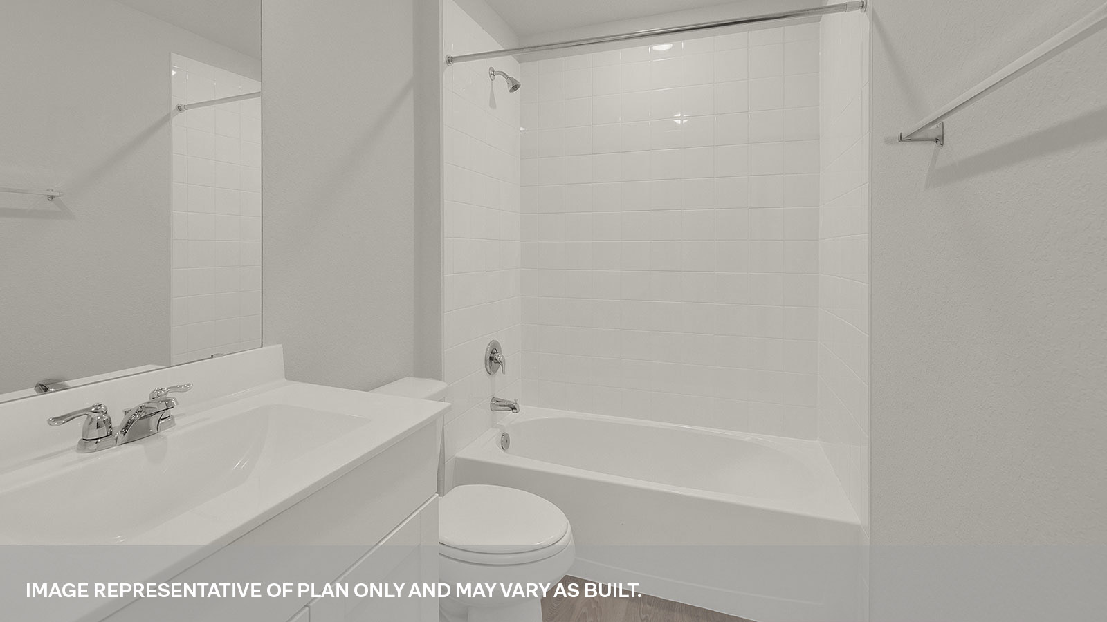 Bathroom with a tile surround shower/tub combo, single sink, and white cabinets.