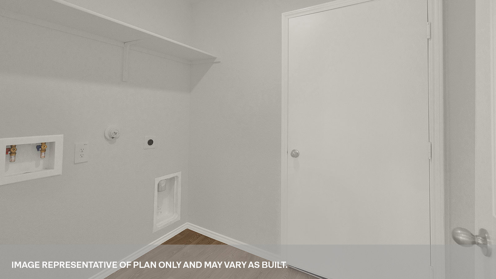 Laundry room with a wood shelf and washer/dryer connections.