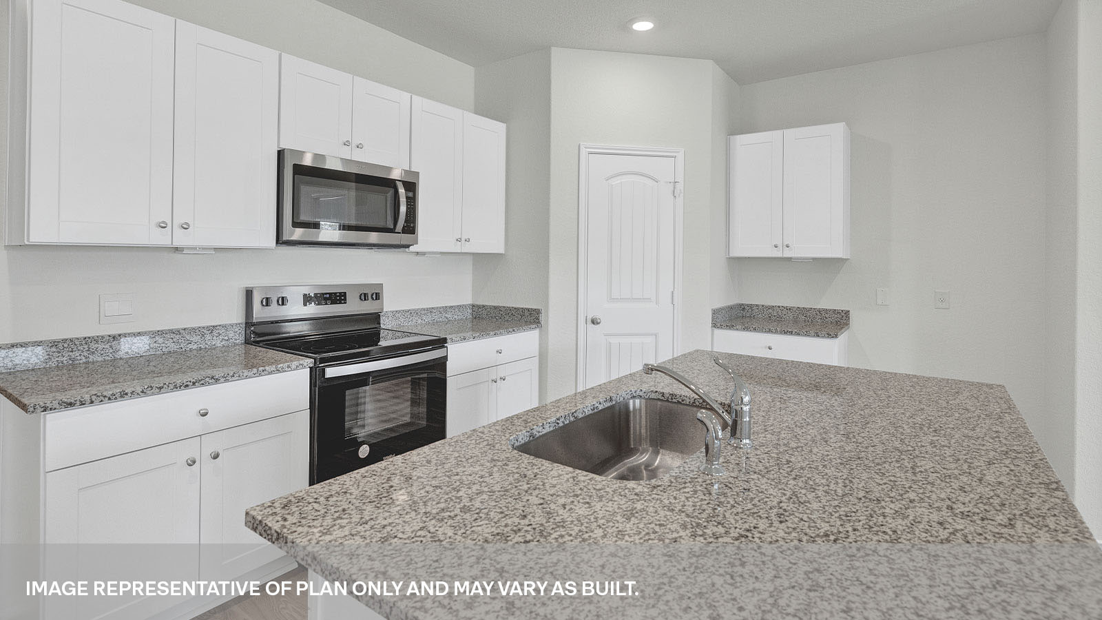 Kitchen with white cabinets, appliances, and granite countertops.