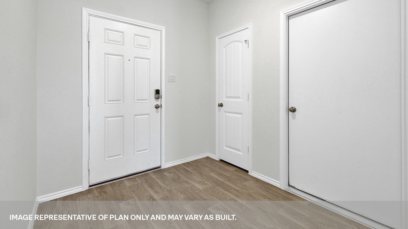 Entry hallway with vinyl flooring and front door.