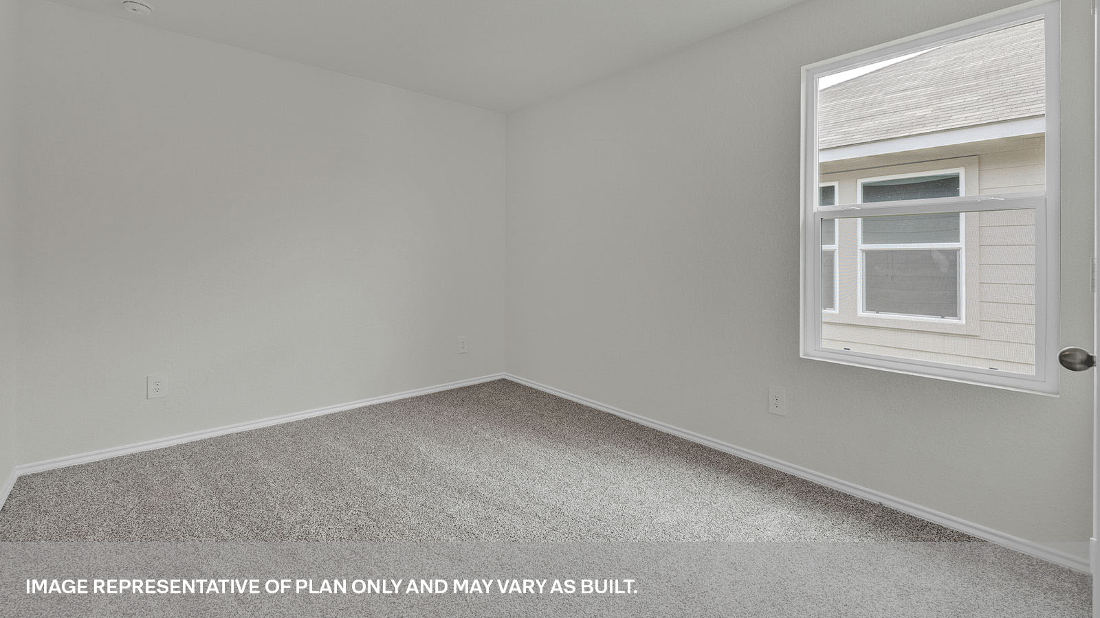 Bedroom with carpeting and one window.