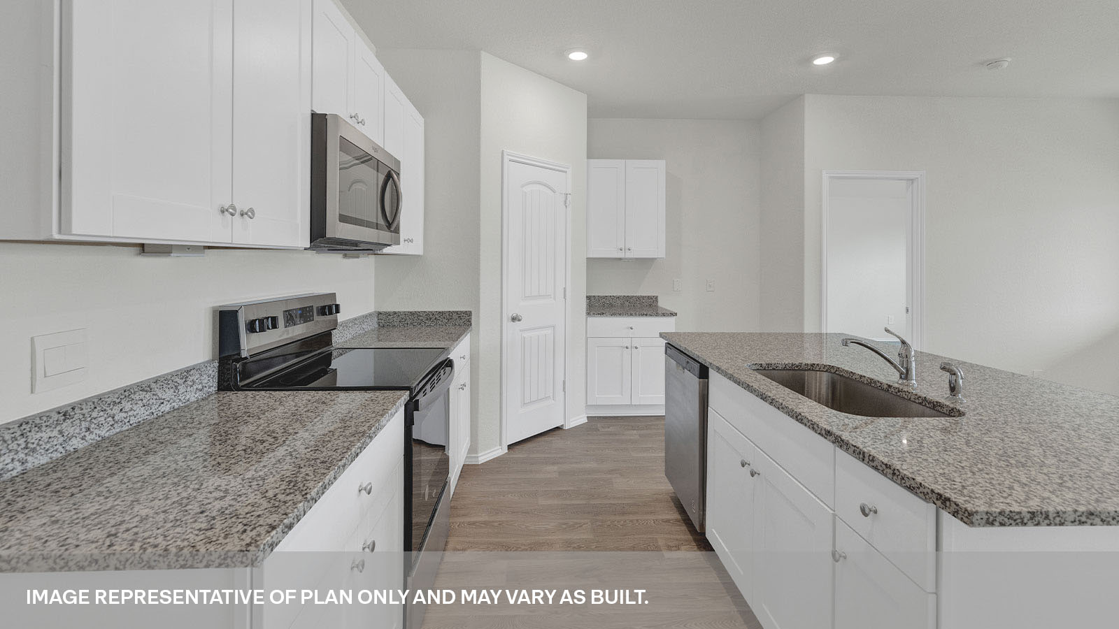 Kitchen with kitchen island and sink.