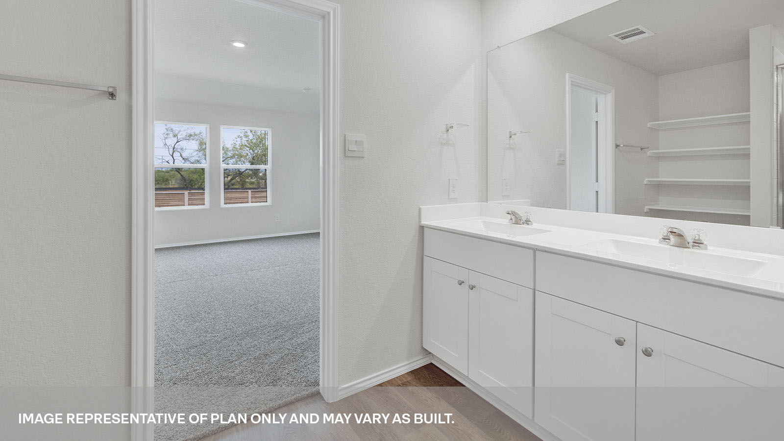 Main bathroom with double sink vanity and bedroom 1 entrance.