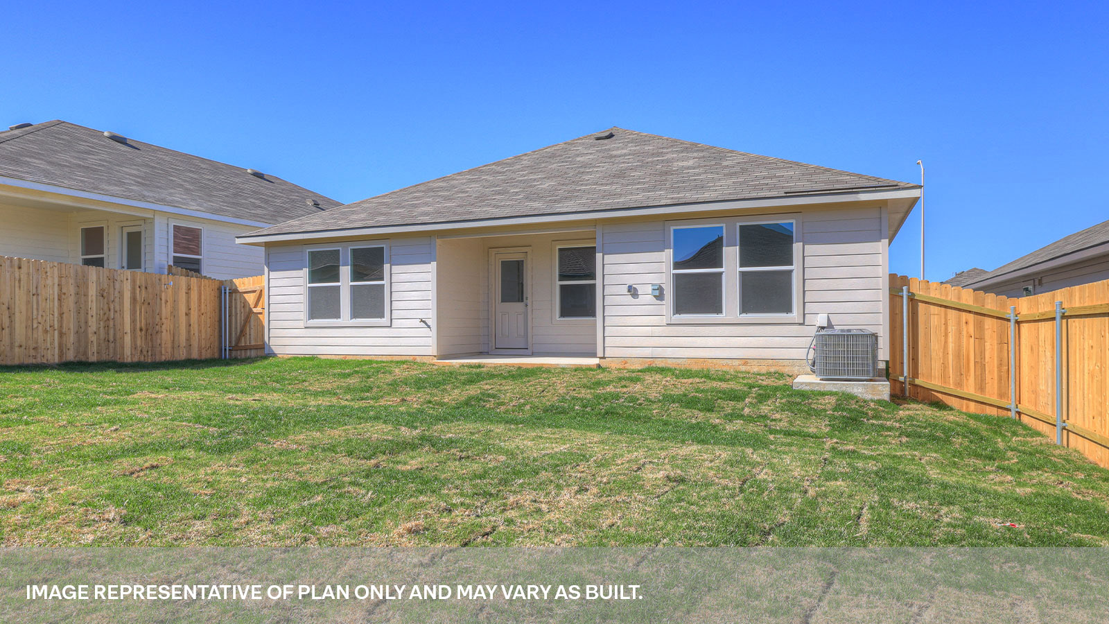 Covered patio with one window and a half lite exterior door.