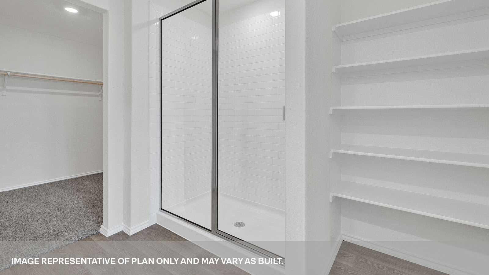 Main bathroom walk-in shower with glass door and wooden shelving.