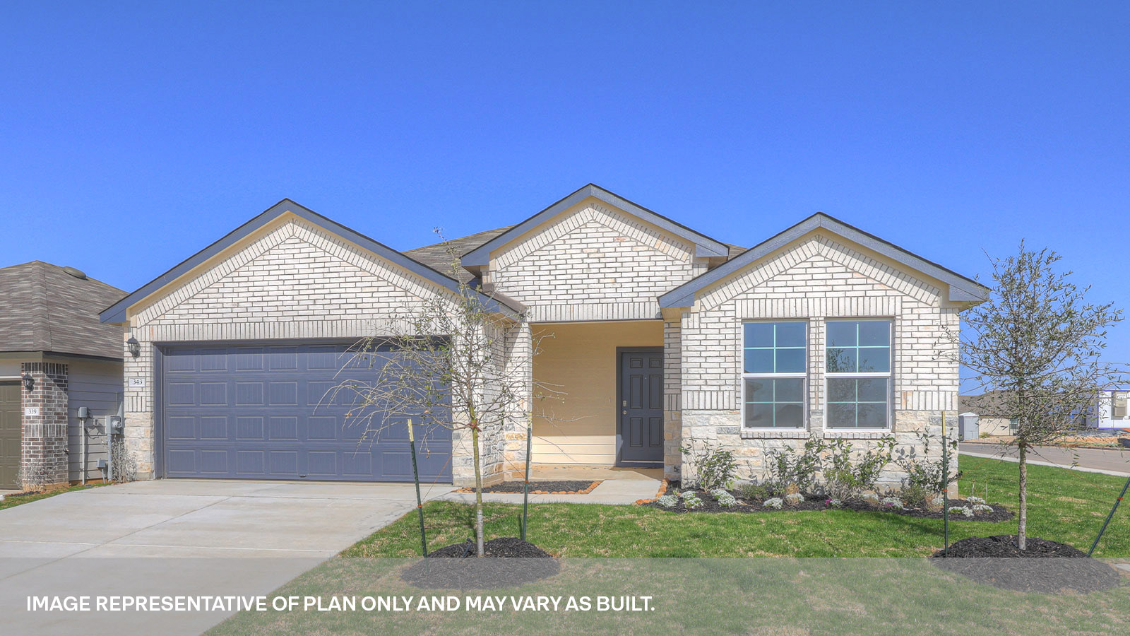 Single story home with stone and brick combo, one window in the front, and a 2 car garage.