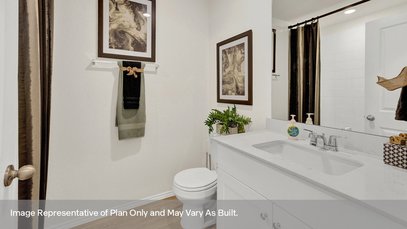 Hall bathroom with single sink vanity, toilet, and tub.