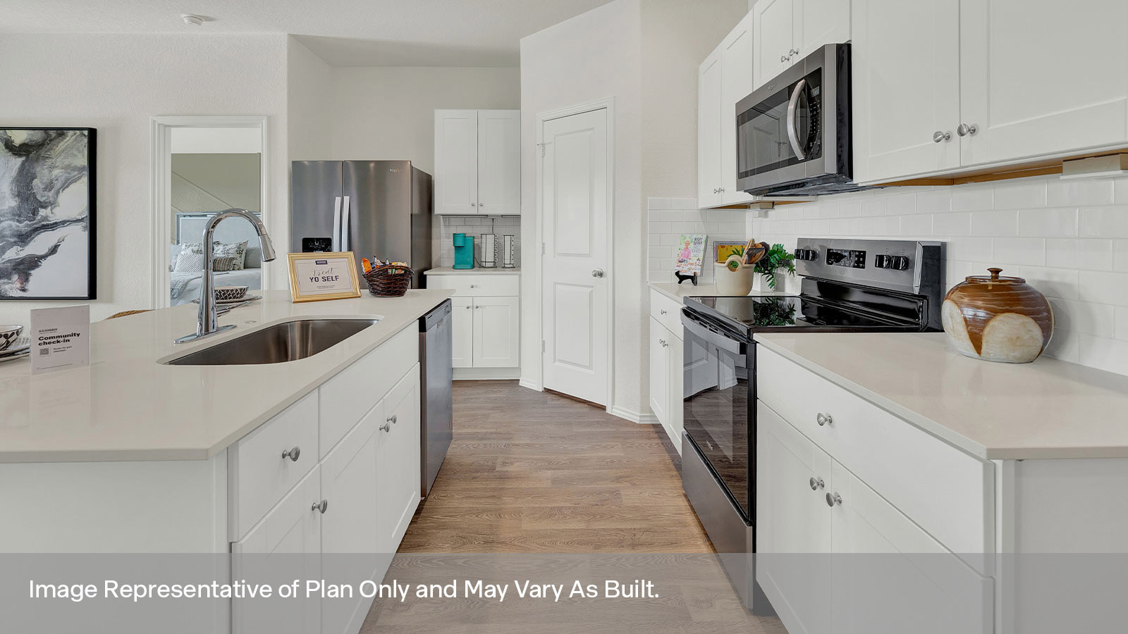 Kitchen with kitchen island and white cabinets.