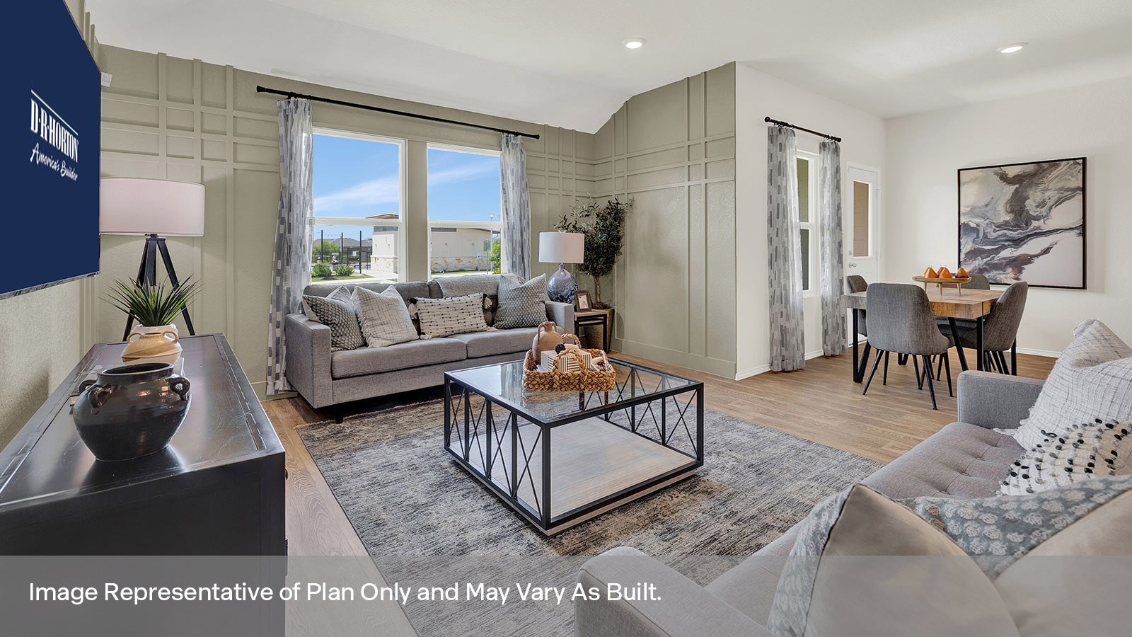 Living room with vinyl flooring and two windows.