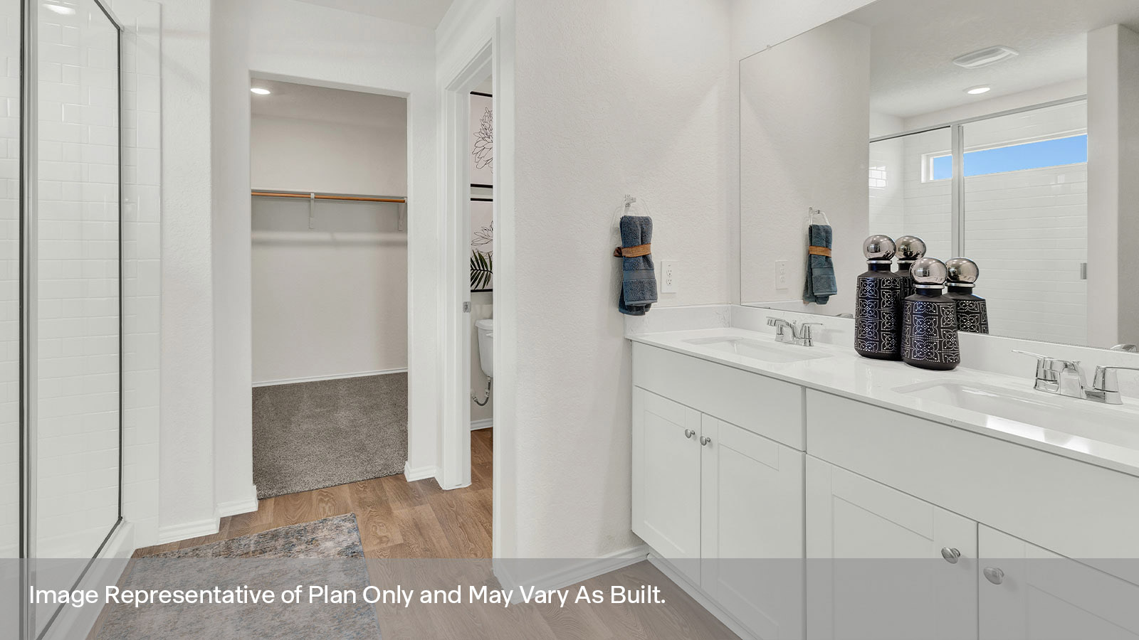 Main bathroom walk-in shower with glass door and wooden shelving.