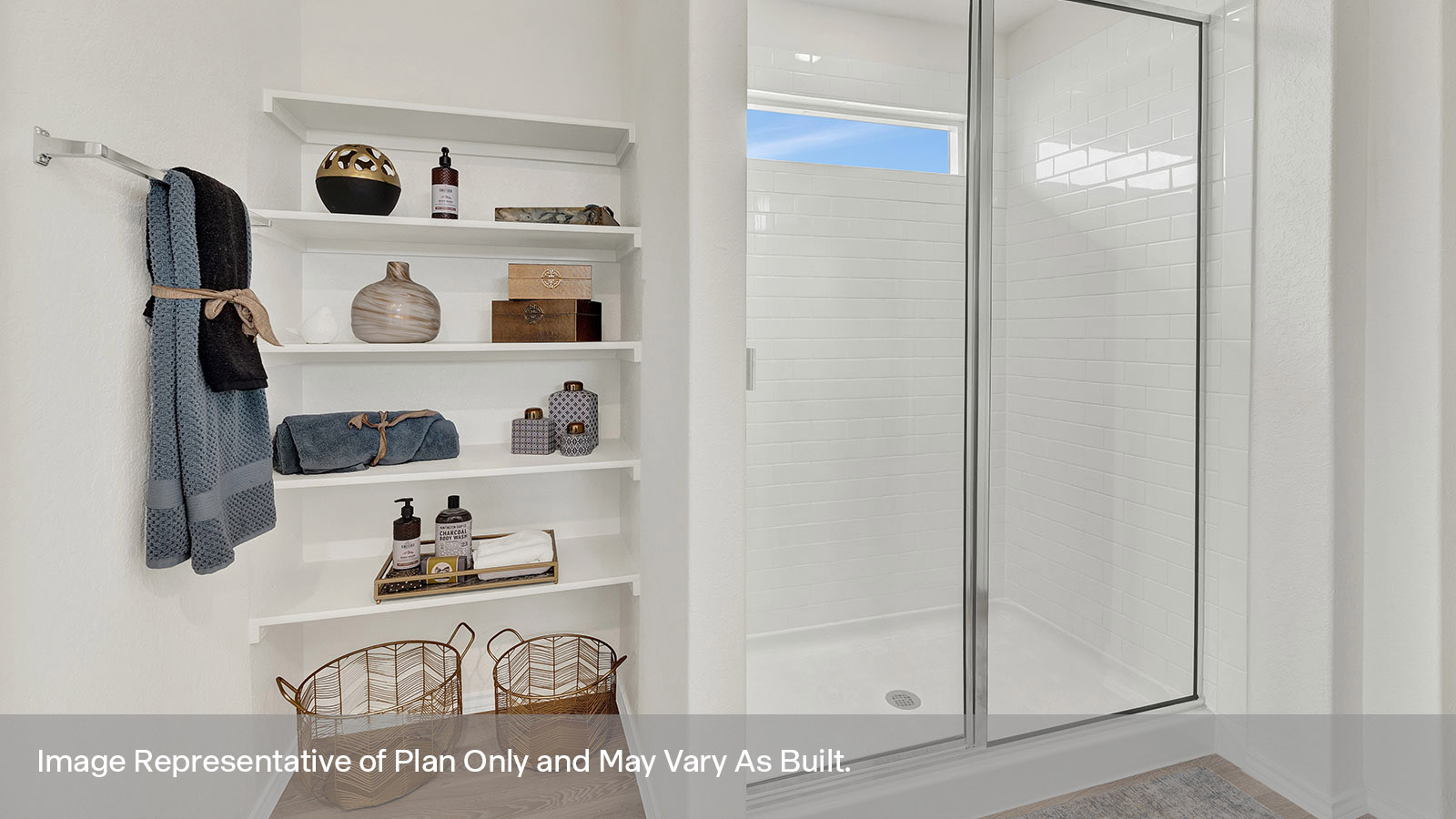 Main bathroom walk-in shower with glass door and wooden shelving.