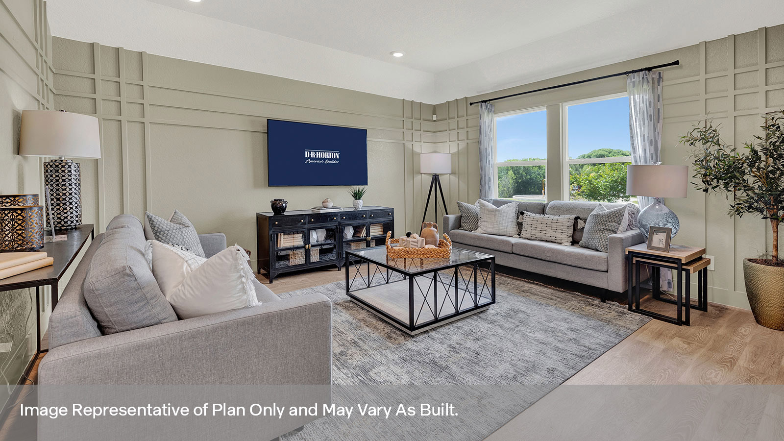 Living room with vinyl flooring and two windows.