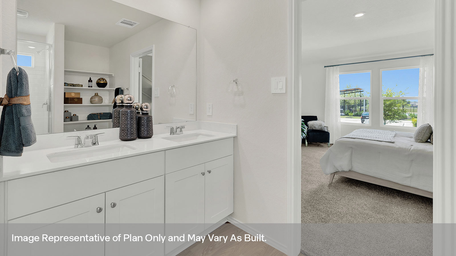 Main bathroom with double sink vanity and bedroom 1 entrance.