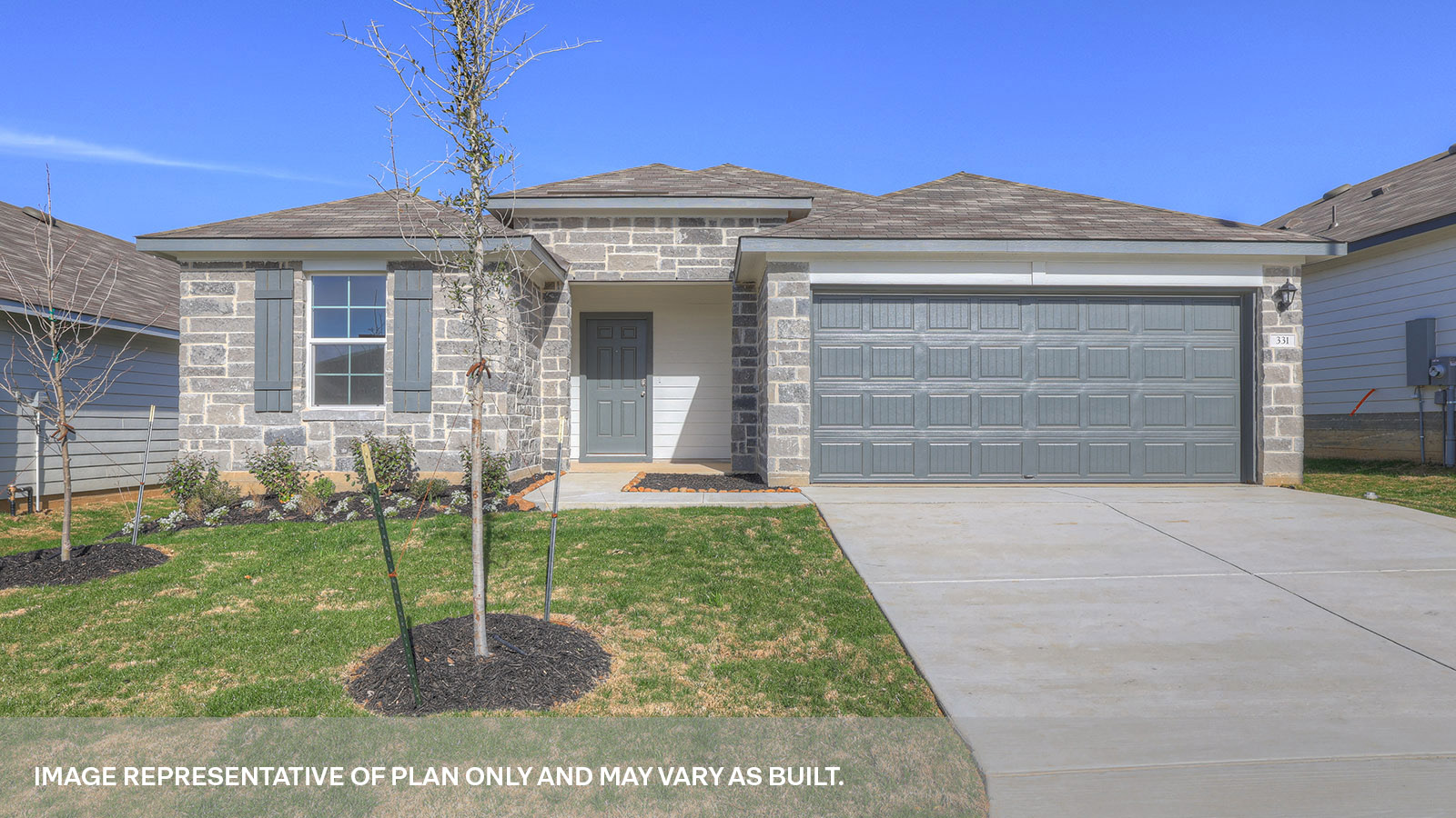Single story home with brick, one window in the front, and a 2 car garage.