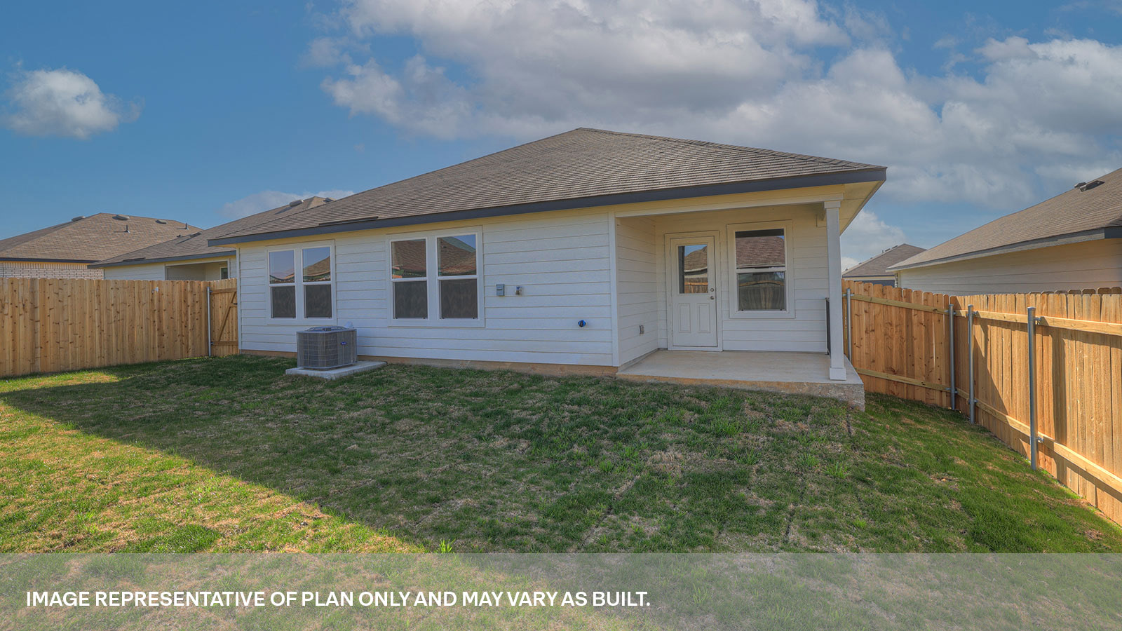 Covered back patio with privacy fence.
