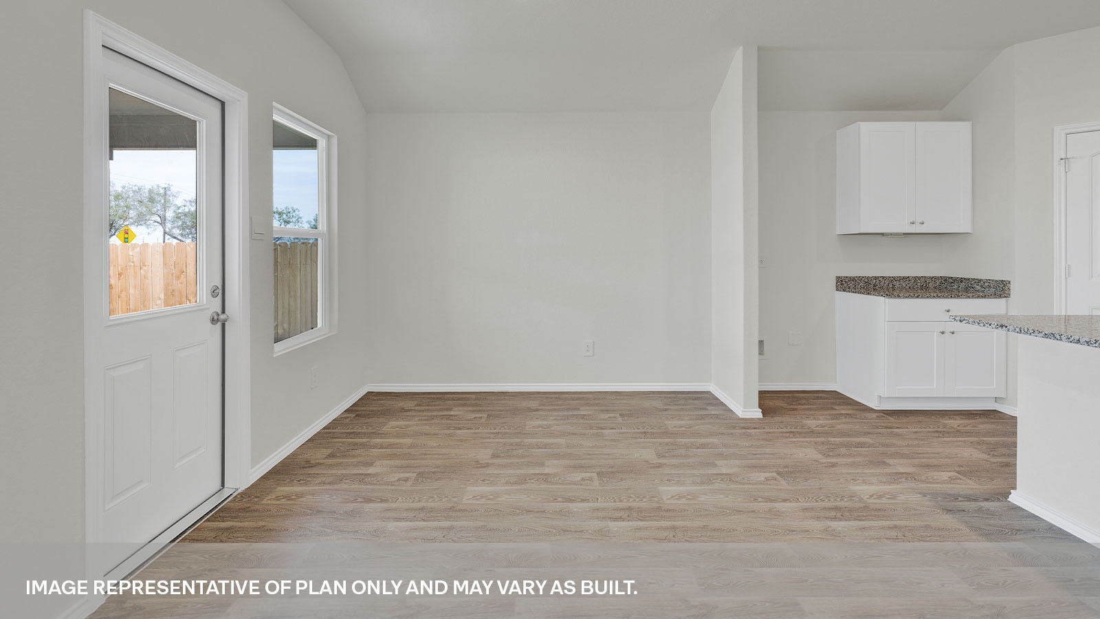 Dining room with vinyl flooring, one window, and a half lite exterior door.