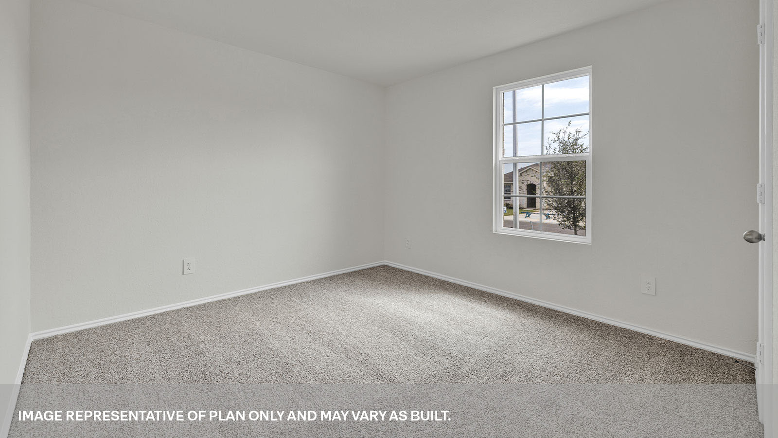 Front bedroom with carpeting and one window.