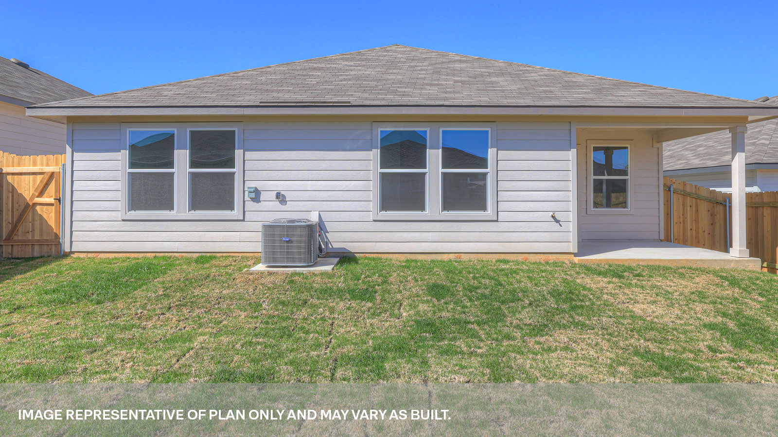 Walk-in closet with wooden shelves.