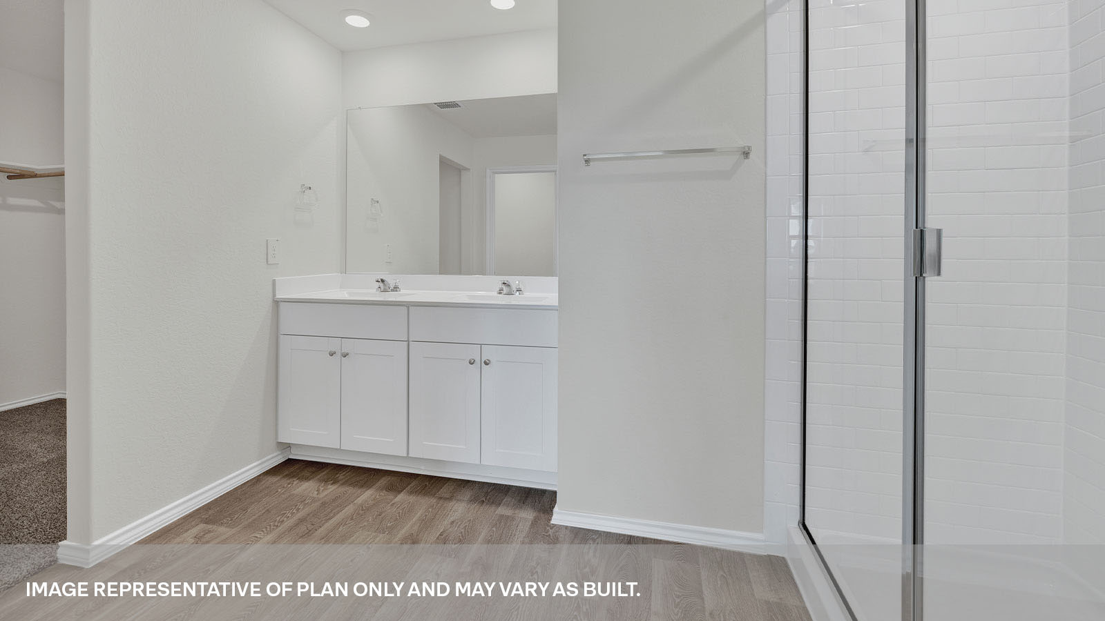 Main bathroom with a double sink and walk-in shower.
